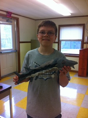 Ryan with his own sturgeon at James H. Bean School, Sidney, ME