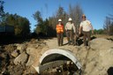 USFWS staff pose in front of a new, fish-friendly culvert in the East Machias.